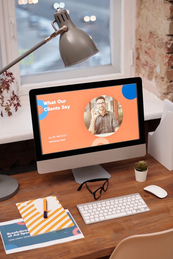 why-choose-us-01 Stylish home office setup with computer showcasing client testimonials.